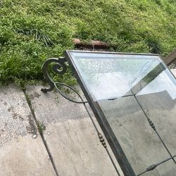 Green marble rod iron stand glass coffee table  it's pretty big about 12 foot squared.