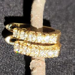 Pair of 14kt yellow gold diamond earrings