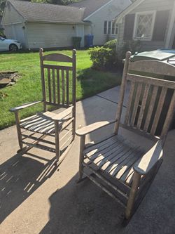 Pair of rustic wooden rocking chairs