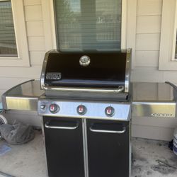 Weber Grill With Storing Cover And 2 Propane Tanks 