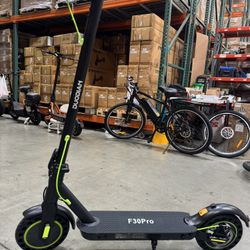 Rear shock-absorbing electric scooter