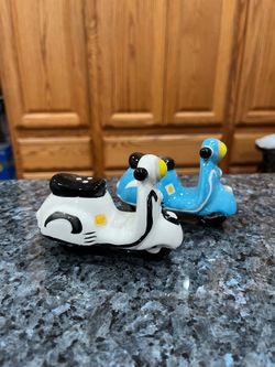 Ceramic Scooters Pair of Salt and Pepper Shakers.  Size approximately 2 3/4 inches tall.  Preowned never used.