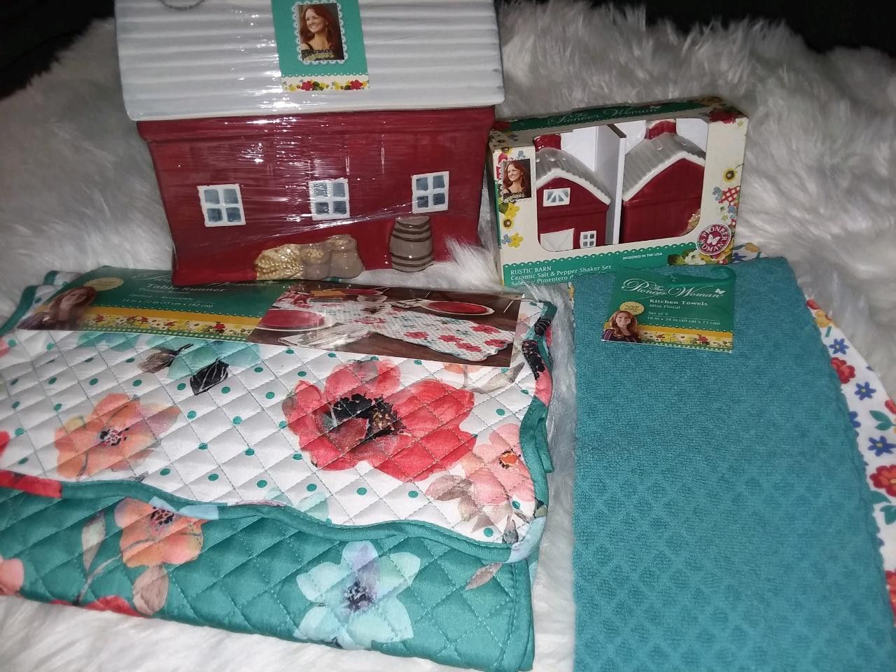 Table runner, Cookie Jar, salt and pepper shaker set, and a kitchen Towels set. No Low ballers