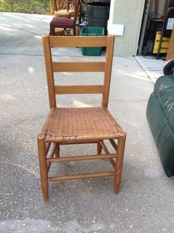 Vintage wooden chair with wicker seat