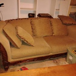 Large Couch With Wood Trim And High Back With 6 Large Pillows