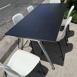 black table and 6 white chairs from Ikea used mesa y 6 sillas de Ikea 