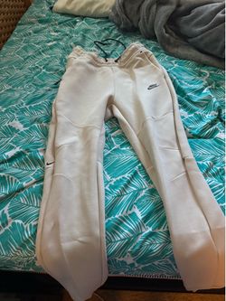 small creame nike tech pants