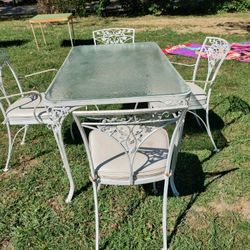 ANTIQUE WROUGHT IRON TABLE & CHAIRS WITH ORIGINAL CUSHIONS.      MARTINSVILLE 