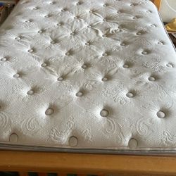 Posturepedic queen mattress with a pillow top. With box springs little tea stain 
