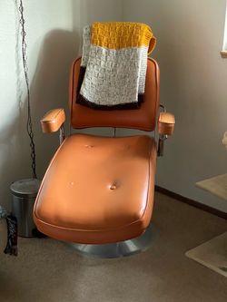 leather tattoo or dentist(?) chair