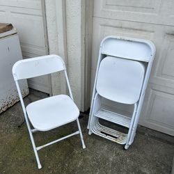 8 White Folding Chairs