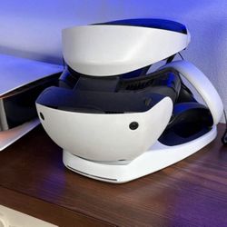 Playstation 5 VR2 with charging base and controllers.