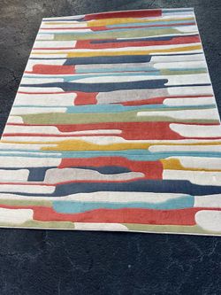 modern abstract rug from the Livabliss City collection features a colorful striped design.