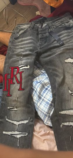Amiri Distressed Jeans with Logo Patch