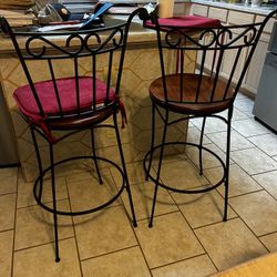 2 Black Wrought Iron Stools With Brown Wooden Seat