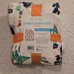 Blanket Dinosaurs On One Side, Orange Sherpa On The Other 