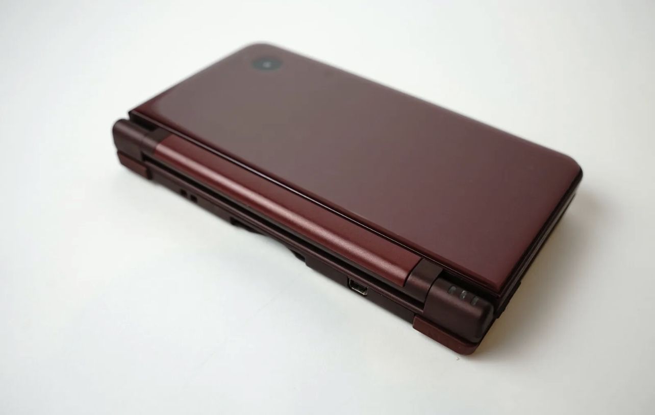 Restored Nintendo DSi XL (Burgundy) Handheld Video Game Console with Stylus  and Charger (Refurbished) 