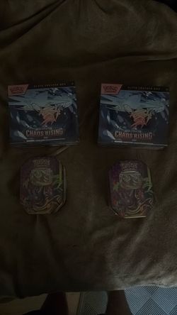 Elite trainer box and tin packs