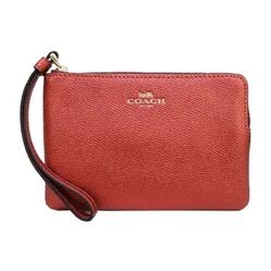 red metallic coach wristlet