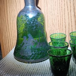 vintage green glass 10pc decanter set with a silver overlay design