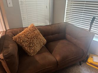 2 couches, table with 4 chairs.
