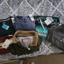 2 shirts, 3 sweatshirts, 1 swim suit and 1 short