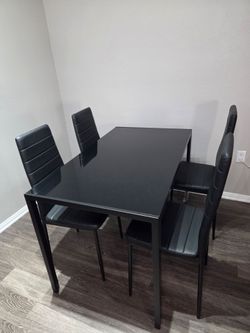 Glass top dinning table and chairs