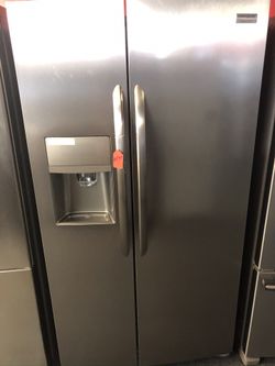 Used Frigidaire Gallery side by side stainless steel fridge. 1 year warranty