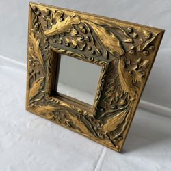 Small Vintage Hanging or Table Mirror Featuring an Ornate Gold Painted Frame with a Detailed Oak Leaf and Acorn Design
