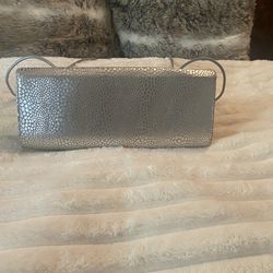 Sleek like new clutch with strap!