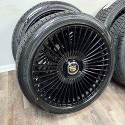 NEW 24 inch gloss black wheels with floating Cadillac caps wrapped in atturo az810 tires 285/40r24