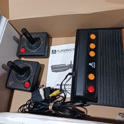 ATARI FLASHBACK 4  Classic game controller.   Good Condition.   76 built in games.  includes 2 wireless controllers. 