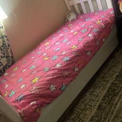 Bed Frame With A Rolling Storage