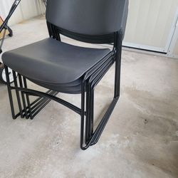 4 Black Plastic Stackable Chairs