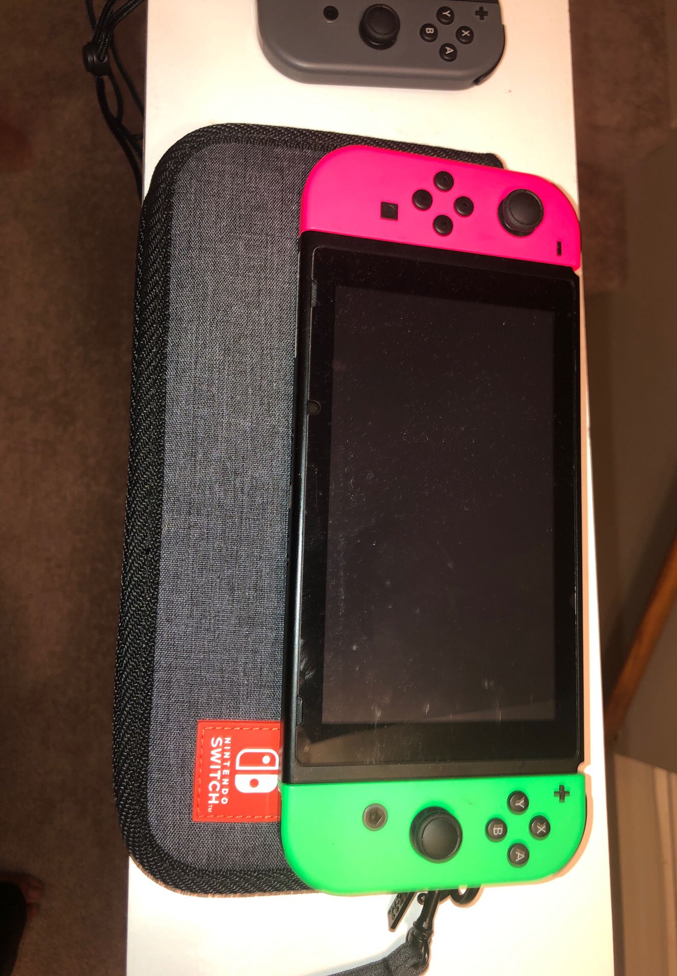 Nintendo switch (with 6games and extra set of remotes and travel case)