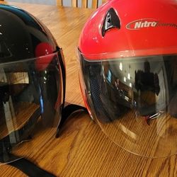 2 motorcycle helmets... Block one is $20... Red is $40...