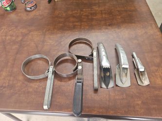 3 oil filter Wrenches and 3 oil spots - in chandler