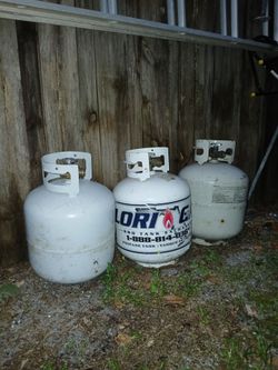 3 empty propane tanks