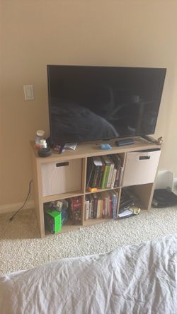 Tv with shelf
