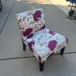 Armless accent chair in striking plum & taupe floral upholstery pattern on dark tapered wooden legs