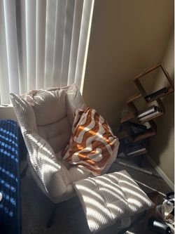 beige lounge chair with footrest