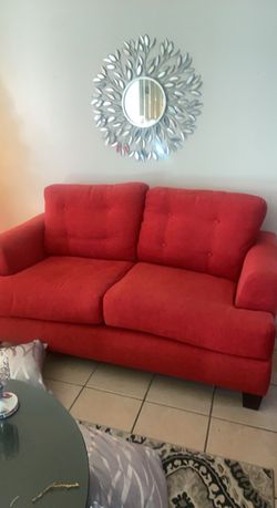 Red sofas and love seat