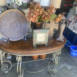 Table With Everything On top And Mirror With 2 Candle Holders