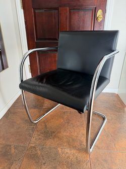 Set of two silver and black leather MCM chairs