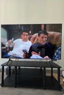 55" Samsung smart TV in great working condition with TV stand