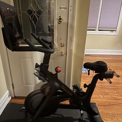 Peloton Bike++ with shoes and mat