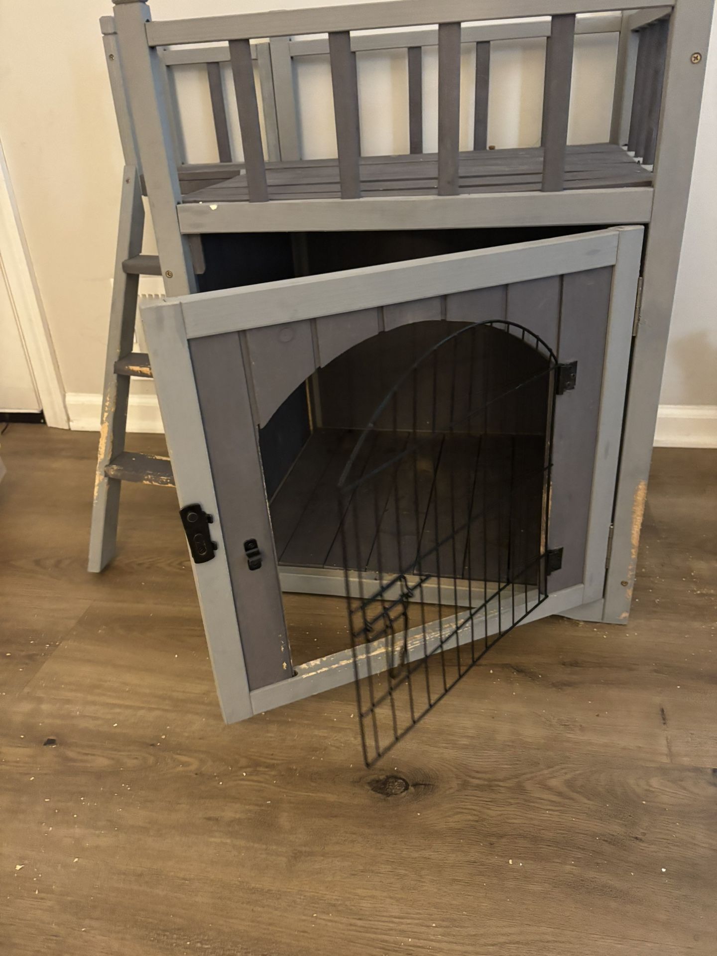 wooden two story doghouse