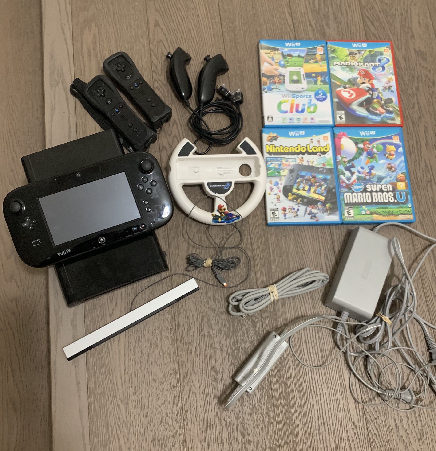 Wii U w/ 4 games, 2 controllers, 2 nunchucks and all cables