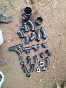 Plumbing parts 1 1/2 inch abs fittings, 2 inch abs fittings, a couple 3 inch abs fittings, a bunch of 1/2 in. And 3/4 in. Pex fittings and cramps, ang