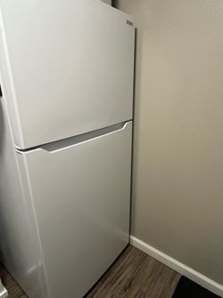 Refrigerator like new, less than a year old